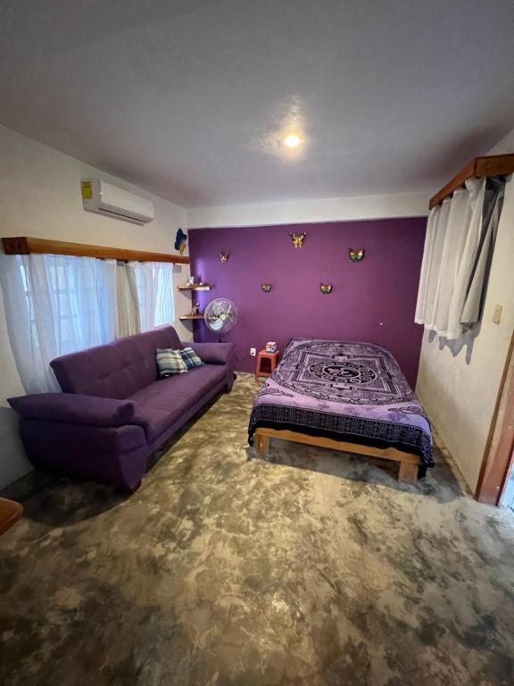 Postel nebo postele na pokoji v ubytování Casa Gajah Hotel Cuyo