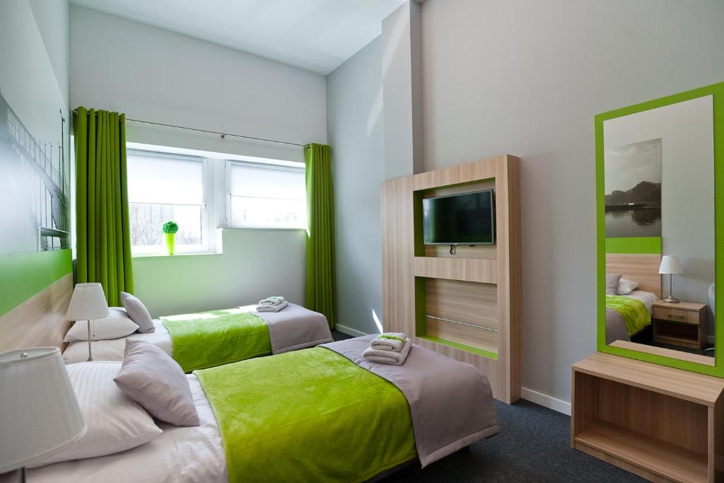 Postel nebo postele na pokoji v ubytování Green Hotel Płock
