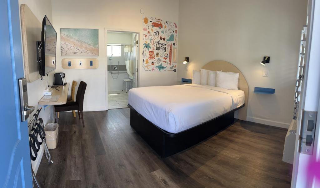 Postel nebo postele na pokoji v ubytování Ocean Palms Motel