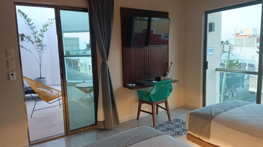 Postel nebo postele na pokoji v ubytování Hotel Yaxactun