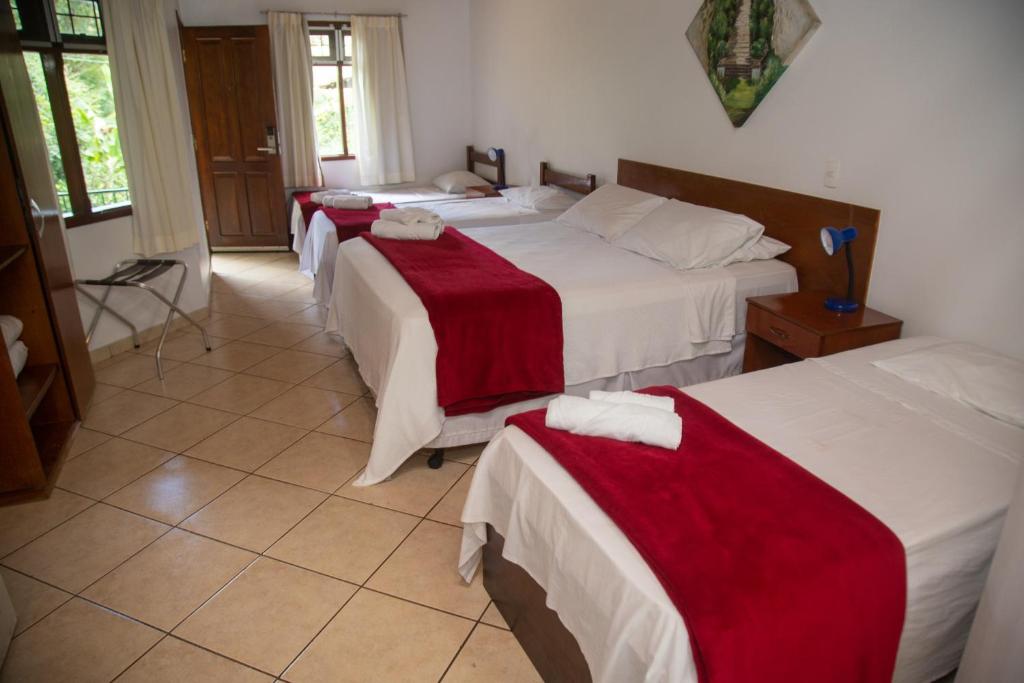 Postel nebo postele na pokoji v ubytování Pousada Casa Rosa