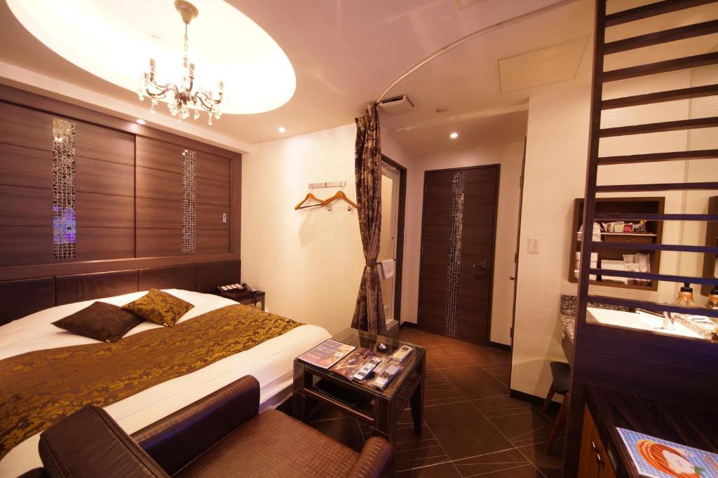 Postel nebo postele na pokoji v ubytování Hotel Lei