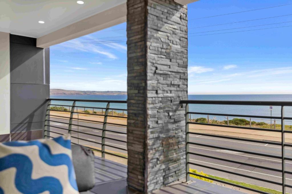 a balcony with a view of the ocean at 180 View by Wine Coast Holiday Rentals in Aldinga Beach