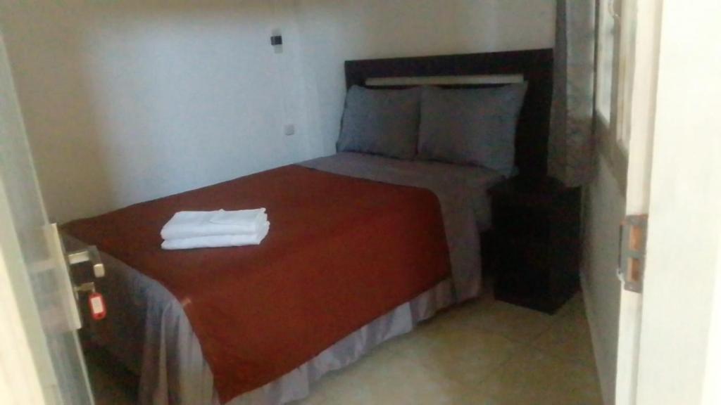Postel nebo postele na pokoji v ubytování Hotel Arda Bali