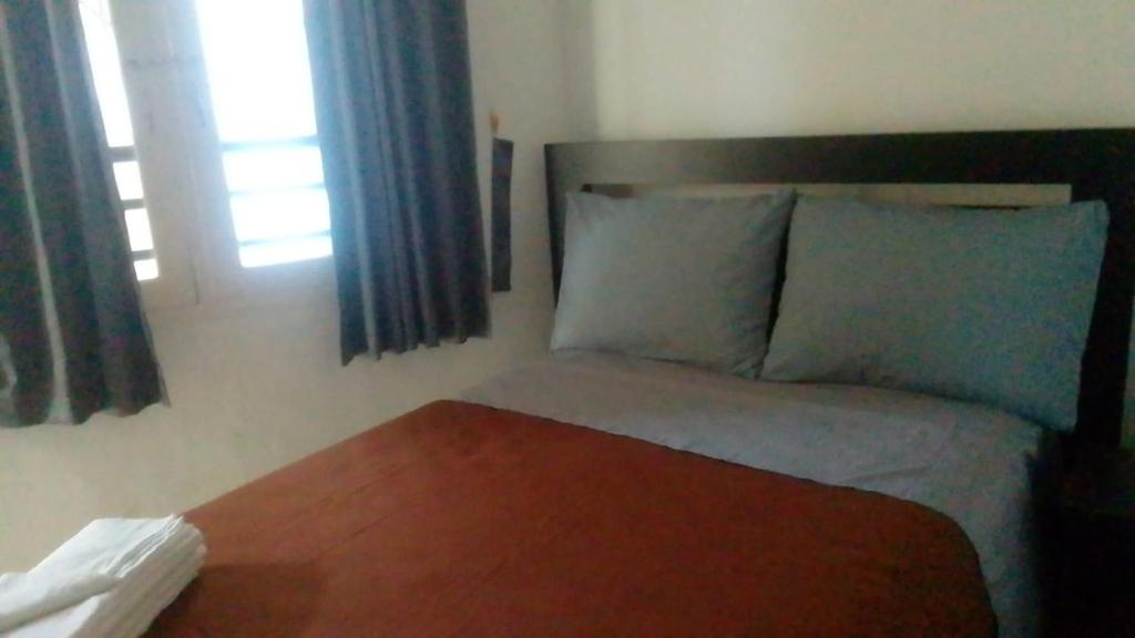 Postel nebo postele na pokoji v ubytování Hotel Arda Bali