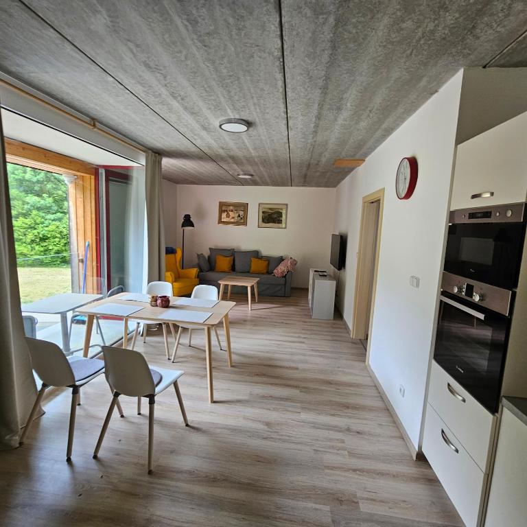 a living room with a table and chairs at Apartmány Pstruží AP19 in Pstruží