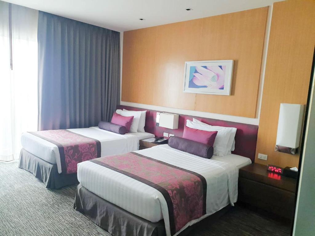 Postel nebo postele na pokoji v ubytování Amaranth Suvarnabhumi Hotel - Free Suvarnabhumi Airport Shuttle