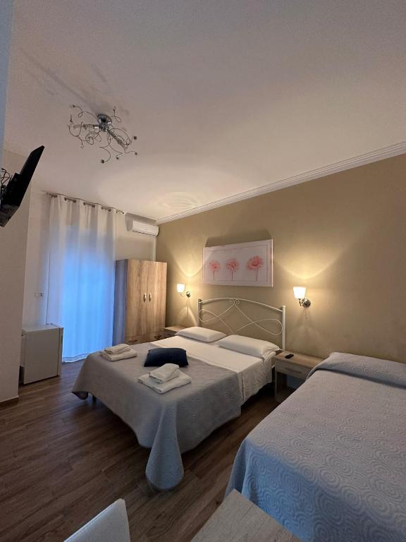 Postel nebo postele na pokoji v ubytování Giardino dei Baroni house