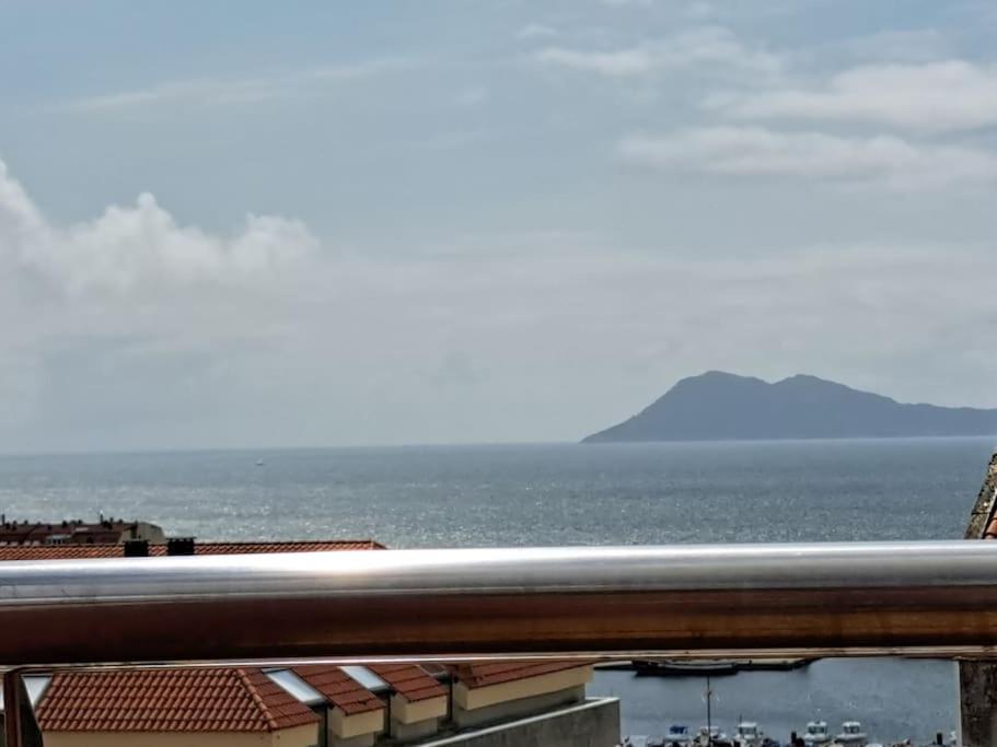 a view of the ocean from a balcony at Casa Antonia Portosín in Portosin