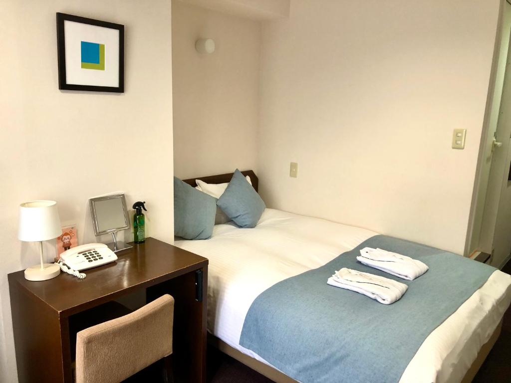 Postel nebo postele na pokoji v ubytování Pod Select Hotel Shinjuku