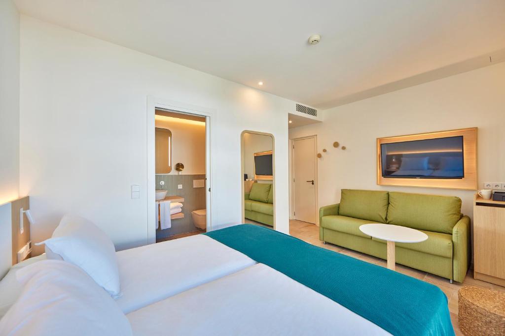 Postel nebo postele na pokoji v ubytování Universal Hotel Aquamarin