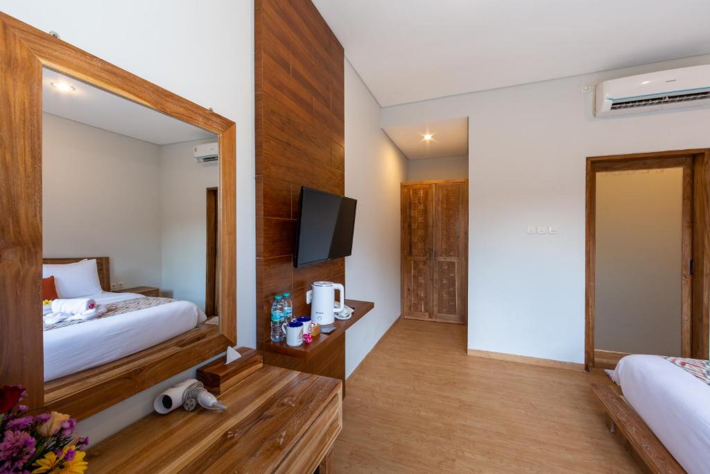 Postel nebo postele na pokoji v ubytování Paisa Ubud