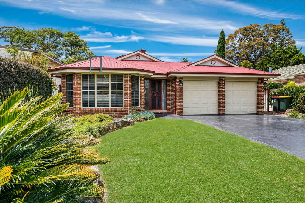 a brick house with a red roof at 'Sanctuary On Walmer' - Sanctuary Point NSW in Sanctuary Point