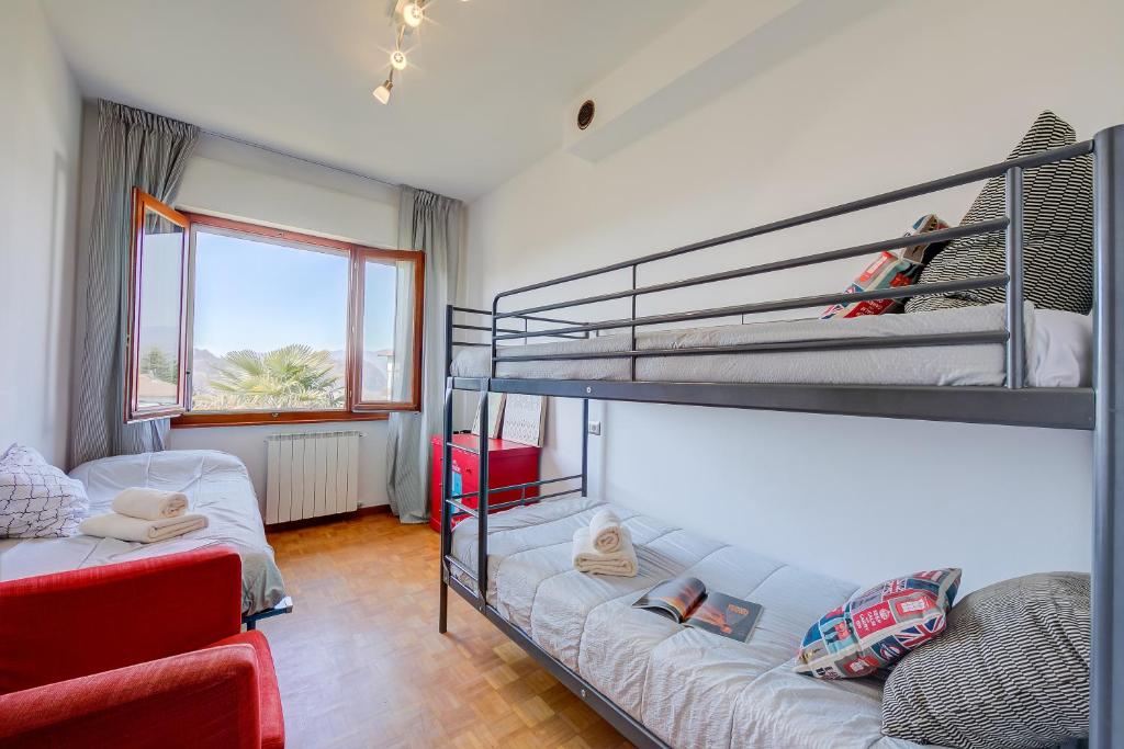 Postel nebo postele na pokoji v ubytování Residenza Il Parco Family Retreat - Happy Rentals