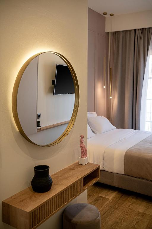 A bed or beds in a room at Ethos Suites