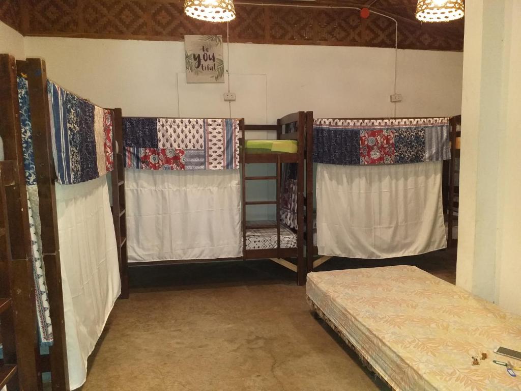 Postel nebo postele na pokoji v ubytování Paraiso Hostel Moalboal