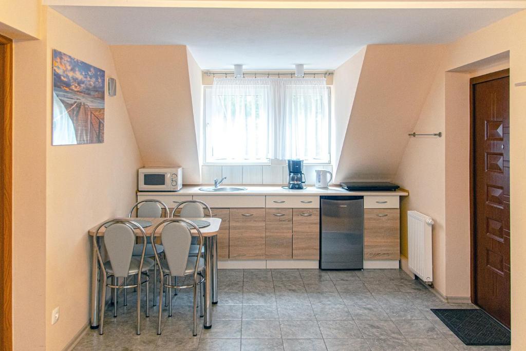 Kuchyň nebo kuchyňský kout v ubytování Sztil - Apartamenty i drewniane domki
