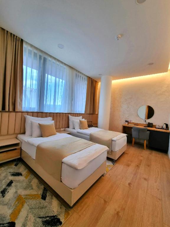 Postel nebo postele na pokoji v ubytování Hotel Emerald