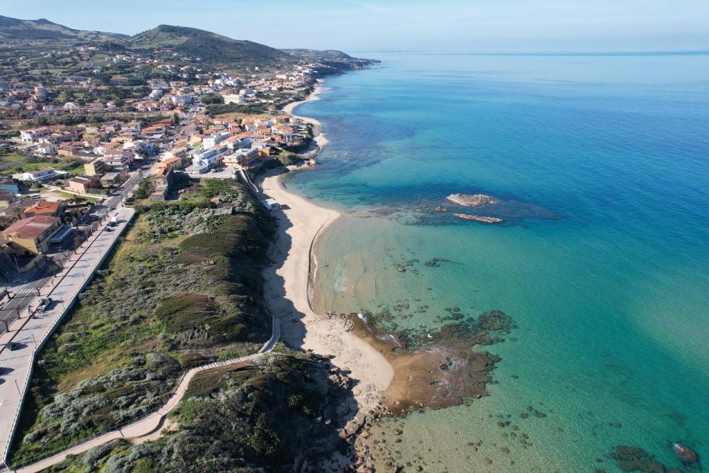 an aerial view of a beach and the ocean at Hotel Residence Ampurias in Castelsardo