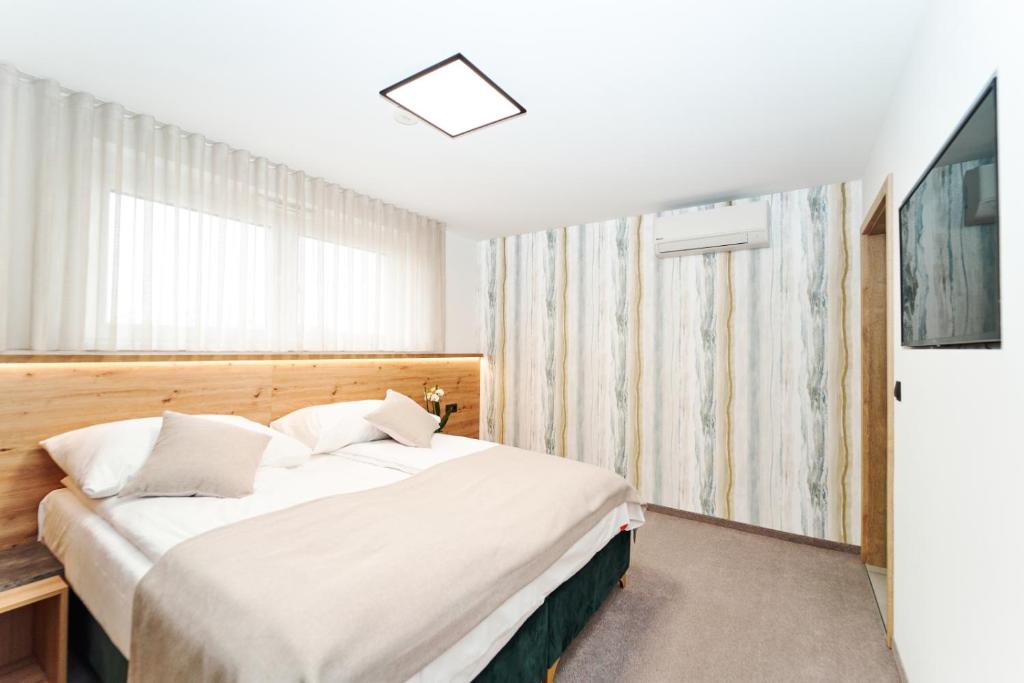 Postel nebo postele na pokoji v ubytování Medirooms Apartments