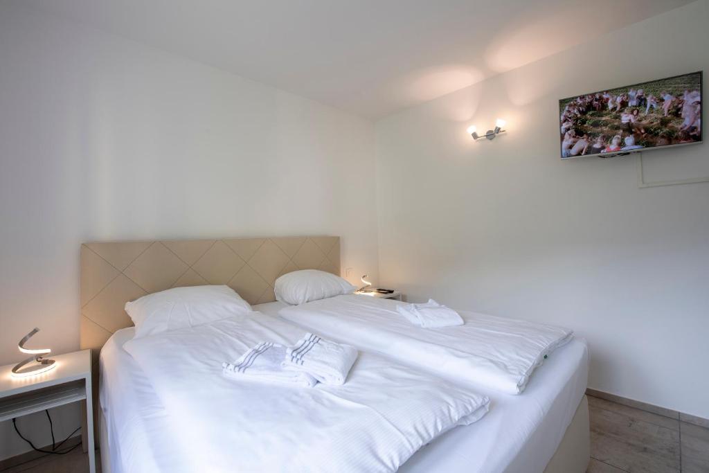 Postel nebo postele na pokoji v ubytování Residenza La Serenata