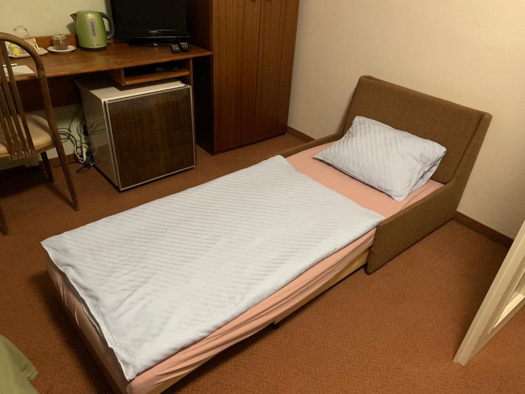 Postel nebo postele na pokoji v ubytování Hotel-Pension KAMÝK