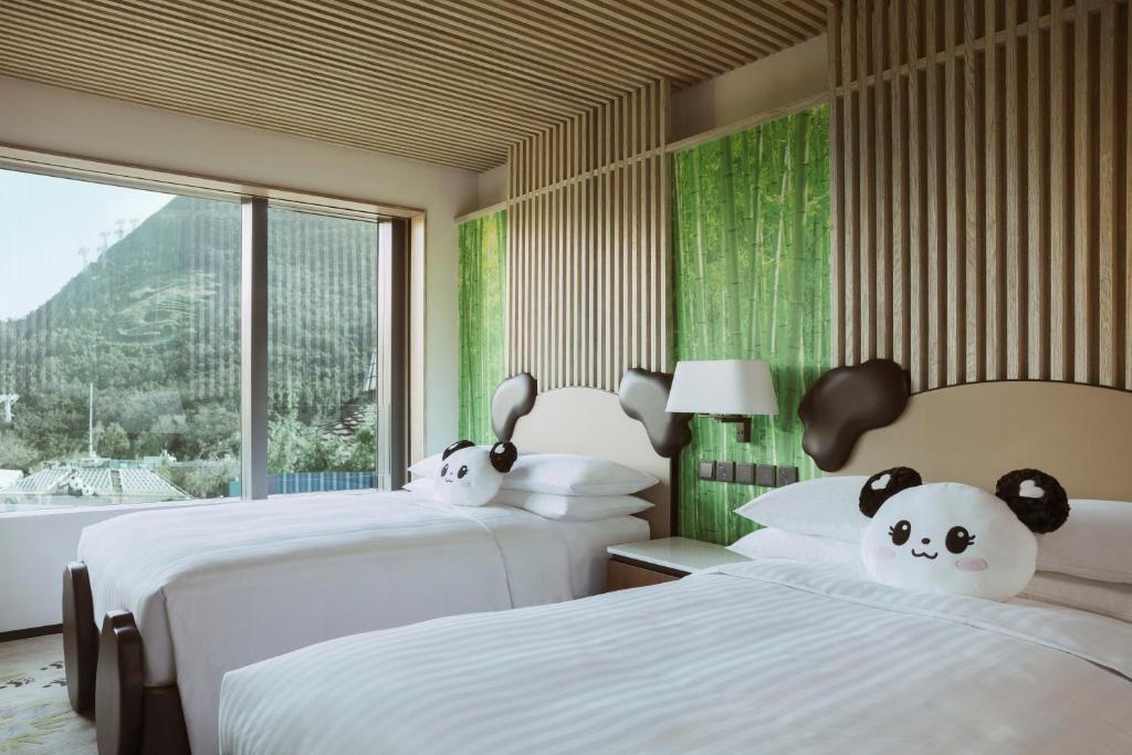 Letto o letti in una camera di Hong Kong Ocean Park Marriott Hotel
