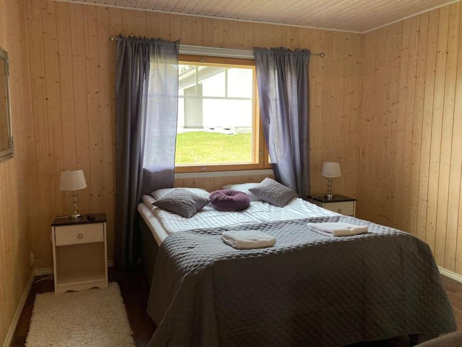 Postel nebo postele na pokoji v ubytování Villa Kupsala , LaatuLomat