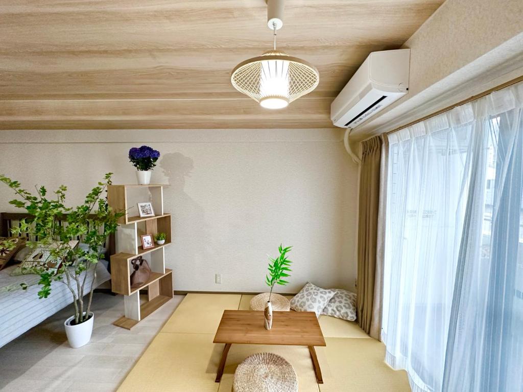 Postel nebo postele na pokoji v ubytování shibuya center -Max 5p-家庭公寓-车站7分-直达新宿涉谷六本木银座
