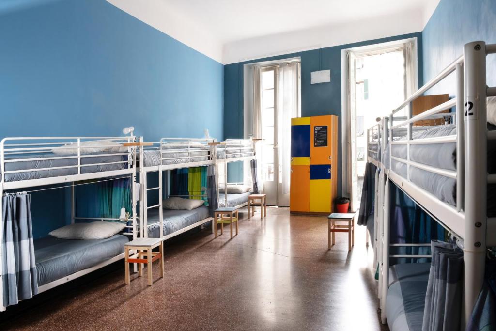 Postel nebo postele na pokoji v ubytování Manena Hostel Genova
