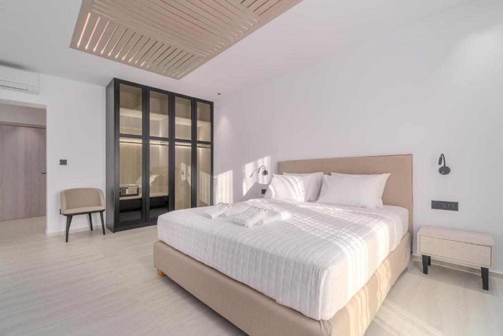 Postel nebo postele na pokoji v ubytování Le Ciel Suites & Villas