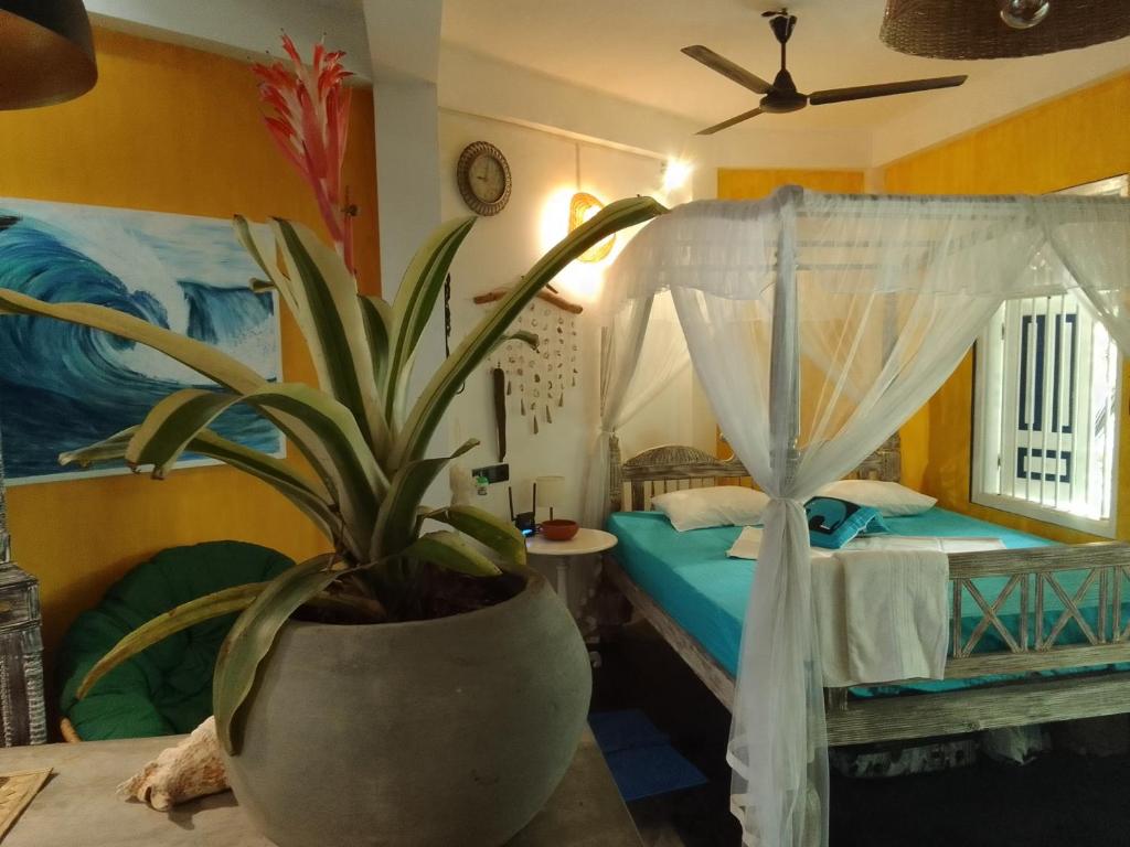 Ένα ή περισσότερα κρεβάτια σε δωμάτιο στο Villa summertime Mirissa