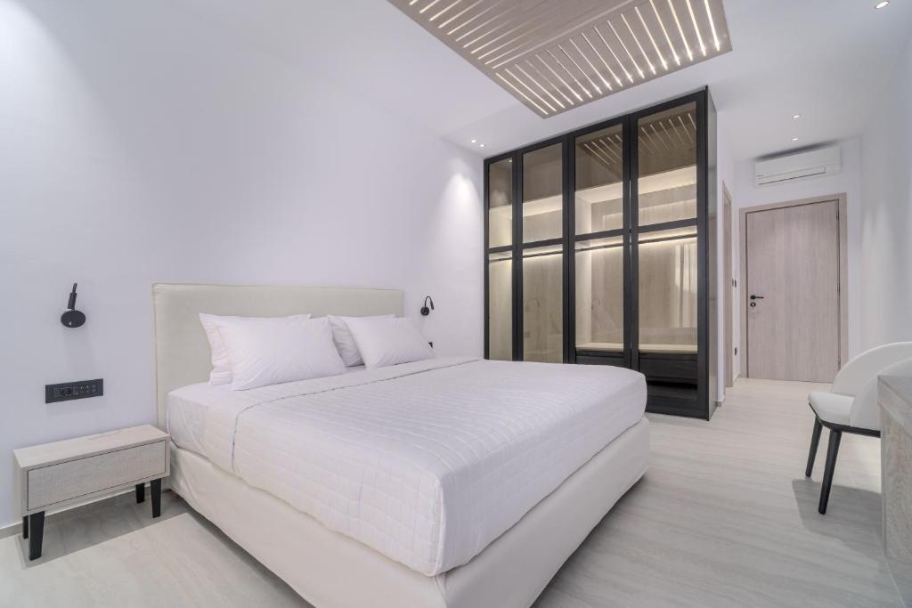 Postel nebo postele na pokoji v ubytování Le Ciel Suites & Villas