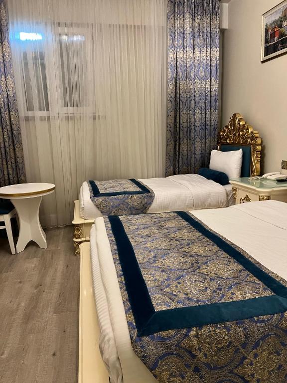 Postel nebo postele na pokoji v ubytování İstasyon Hotel