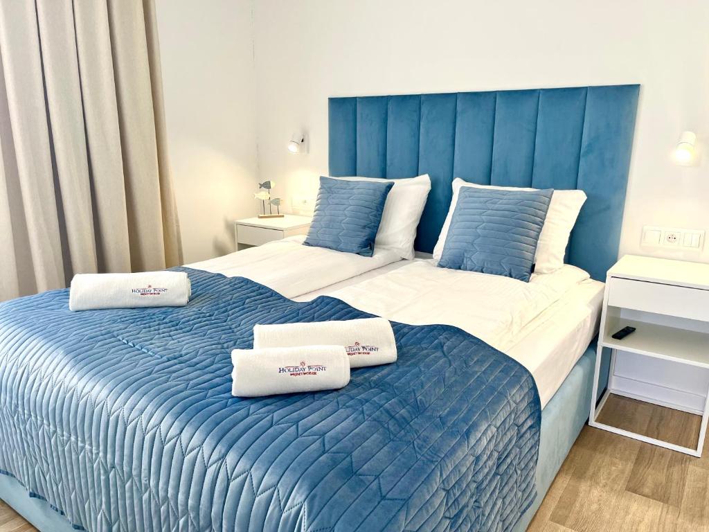 Voodi või voodid majutusasutuse Holiday Point toas