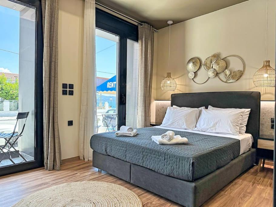 a bedroom with a bed with two towels on it at Oasis Luxury Apartments in Eretria