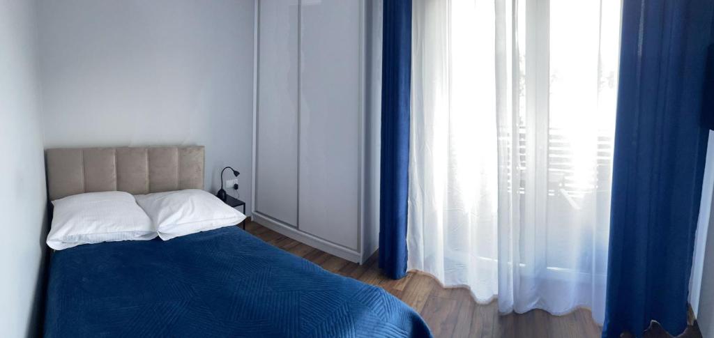 Postel nebo postele na pokoji v ubytování Z Widokiem Apartamenty - apartamenty z widokiem na góry i zewnętrzną balią