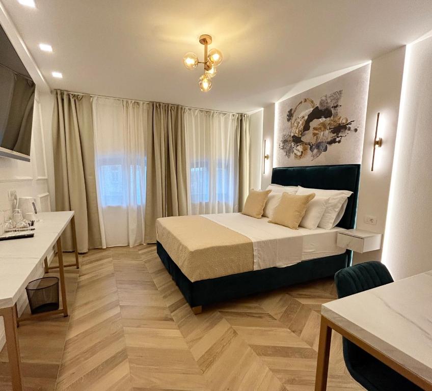 מיטה או מיטות בחדר ב-Villa Olivetta heritage residence