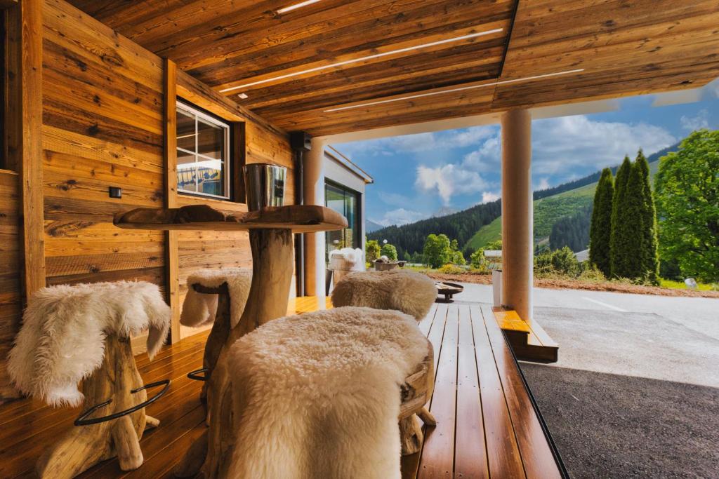 a room with a group of chairs in a building at Landhaus Ramsau in Ramsau am Dachstein