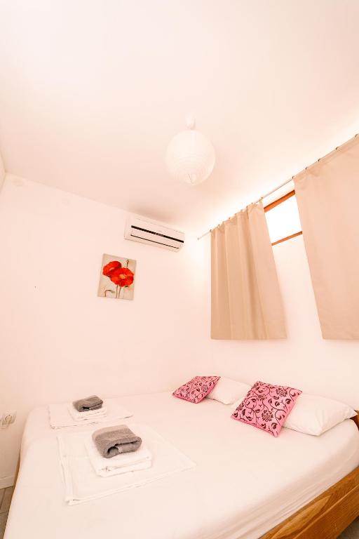 Postel nebo postele na pokoji v ubytování Guesthouse Lastavica