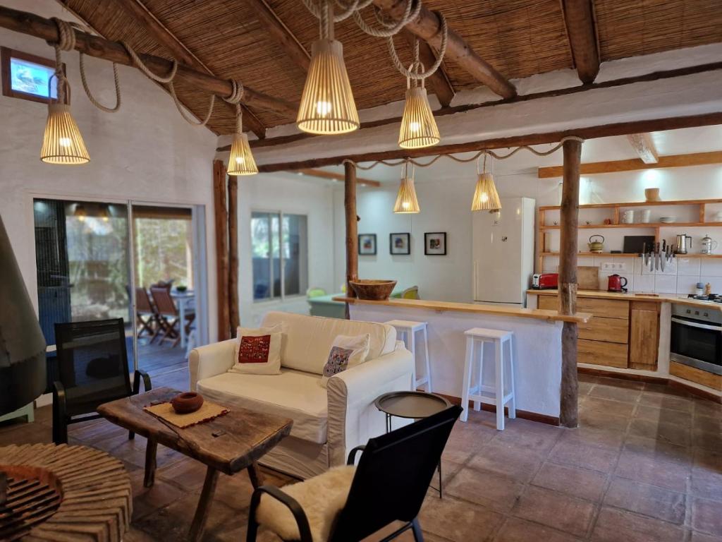 a living room with a couch and a table at Bolonia Beach Campus in Tarifa