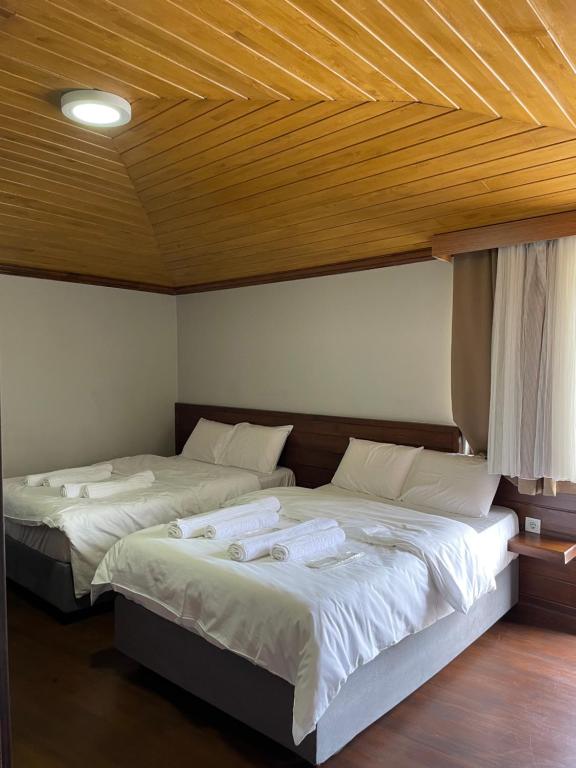 Postel nebo postele na pokoji v ubytování Gold Corner Hotel