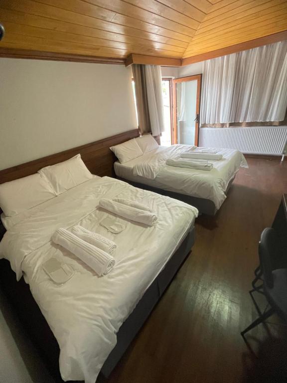 Postel nebo postele na pokoji v ubytování Gold Corner Hotel