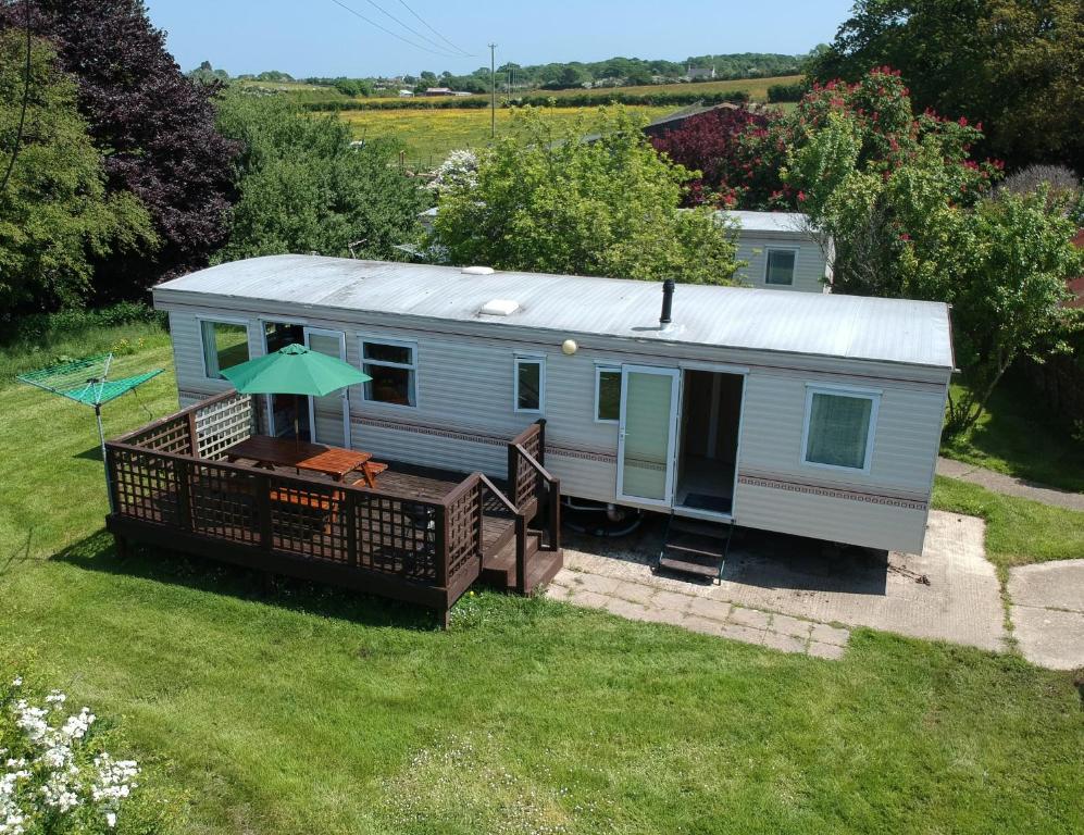an aerial view of a tiny house with a deck at Glebe Farm Holidays in Newport
