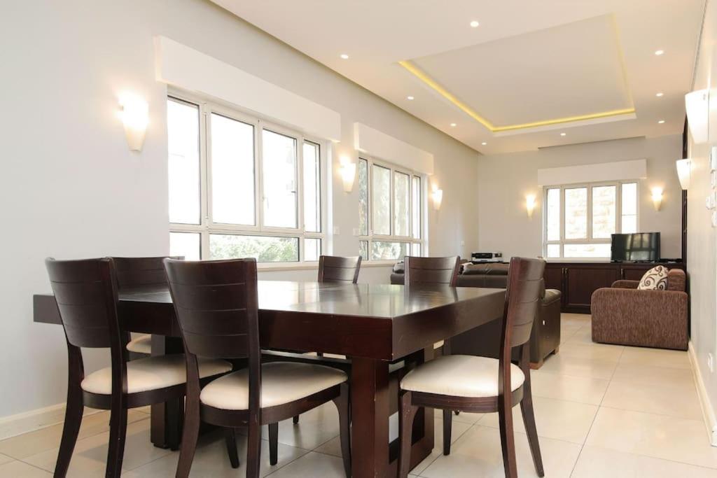 a dining room with a table and chairs at Spacious & Modern 5 bed in the Center of Rechavia! in Jerusalem