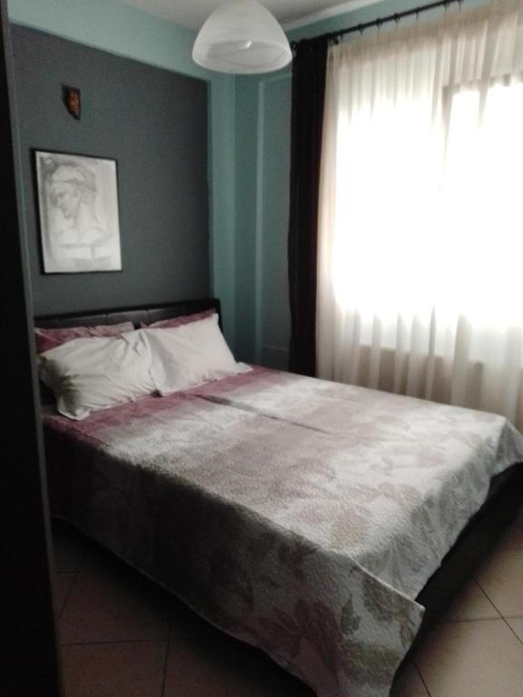Postel nebo postele na pokoji v ubytování SOFI APARTMENT