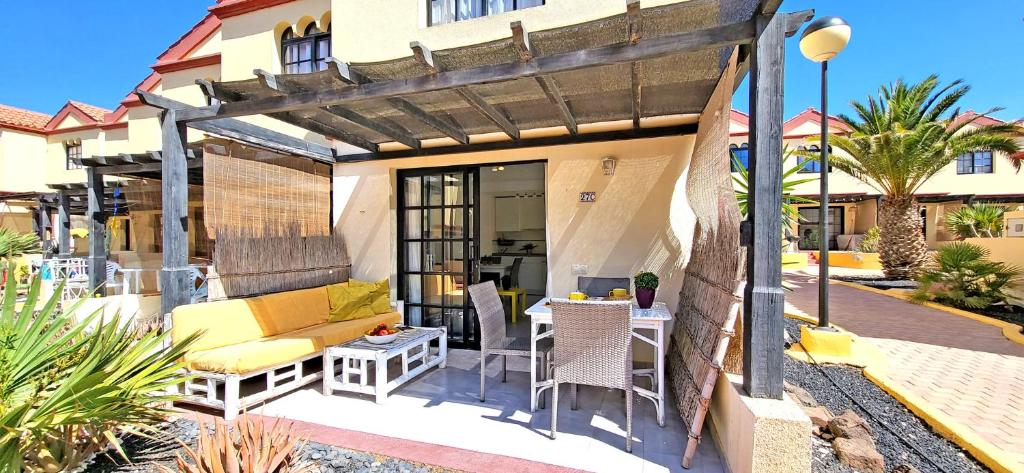 a patio with a couch and a table at Casa del Sol, Costa Calma in Costa Calma