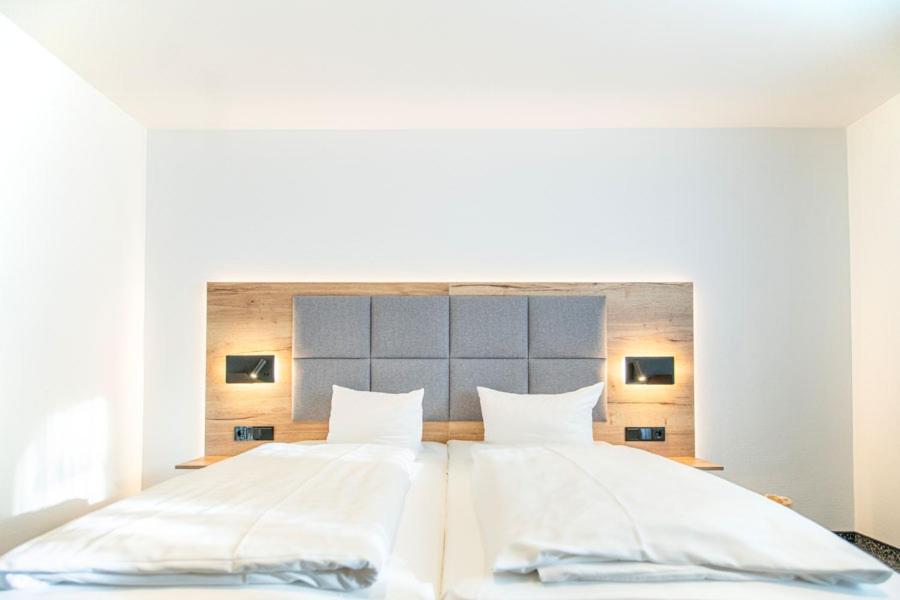 Postel nebo postele na pokoji v ubytování Ringhotel Schlossberg