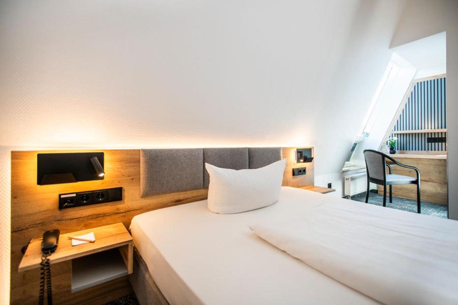 Postel nebo postele na pokoji v ubytování Ringhotel Schlossberg