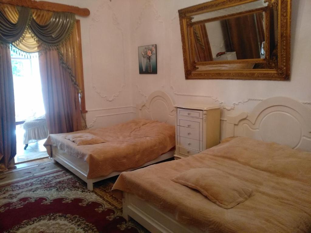 Postel nebo postele na pokoji v ubytování Hotel Royal